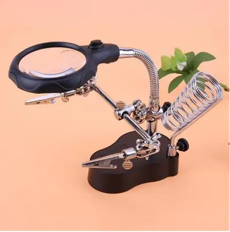Helping Hand with light and magnifying glass